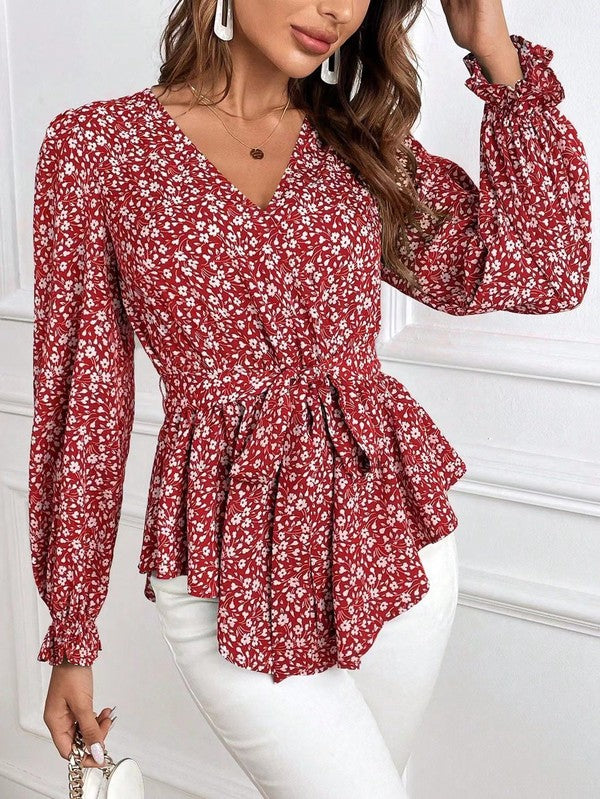 Elegante camicetta a maniche lunghe con stampa floreale e scollo a V